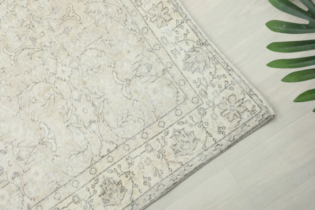 Detailed view of the rug's border pattern and corner design