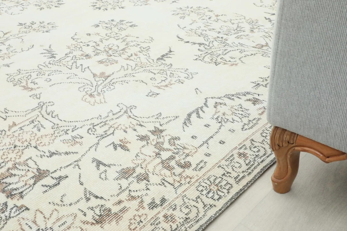 Rug placed under a sofa, showing how it fits into a home decor arrangement.