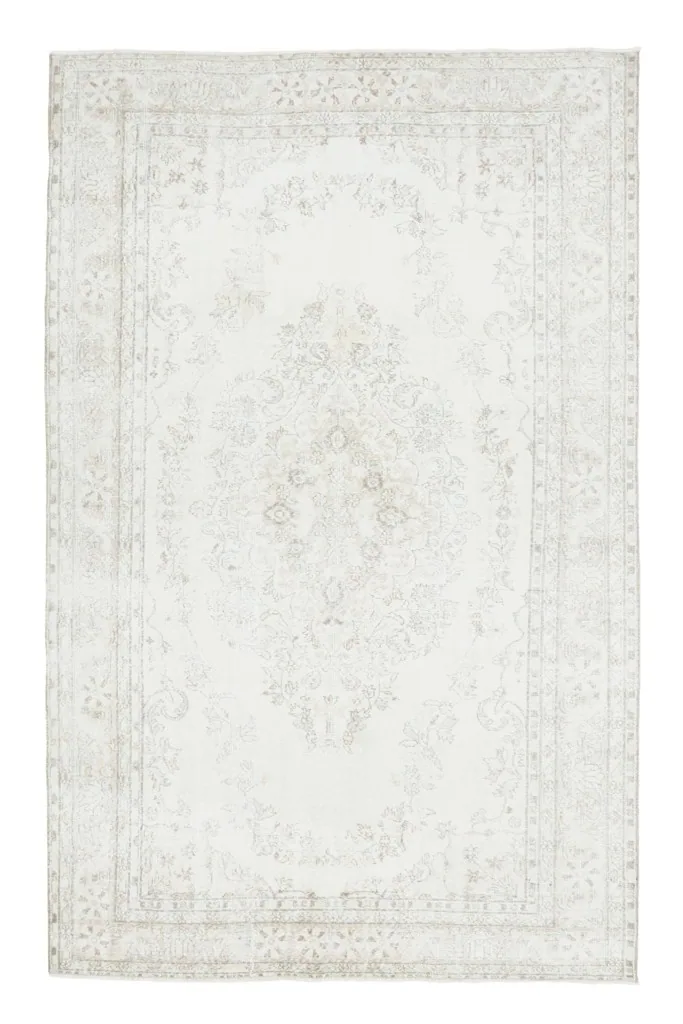 Full overhead view of the large 6'11" x 10'9" ivory and beige vintage Anatolian area rug.