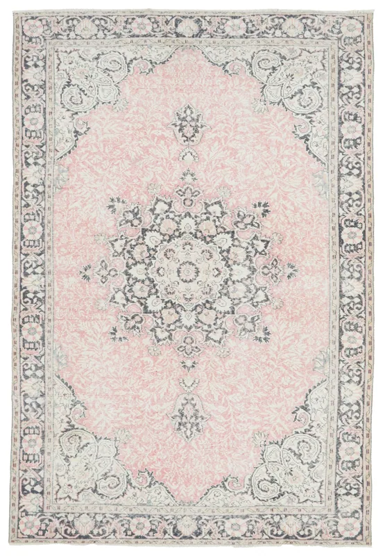 Full top view of the 6'8" x 9'10" rose and navy vintage Anatolian area rug