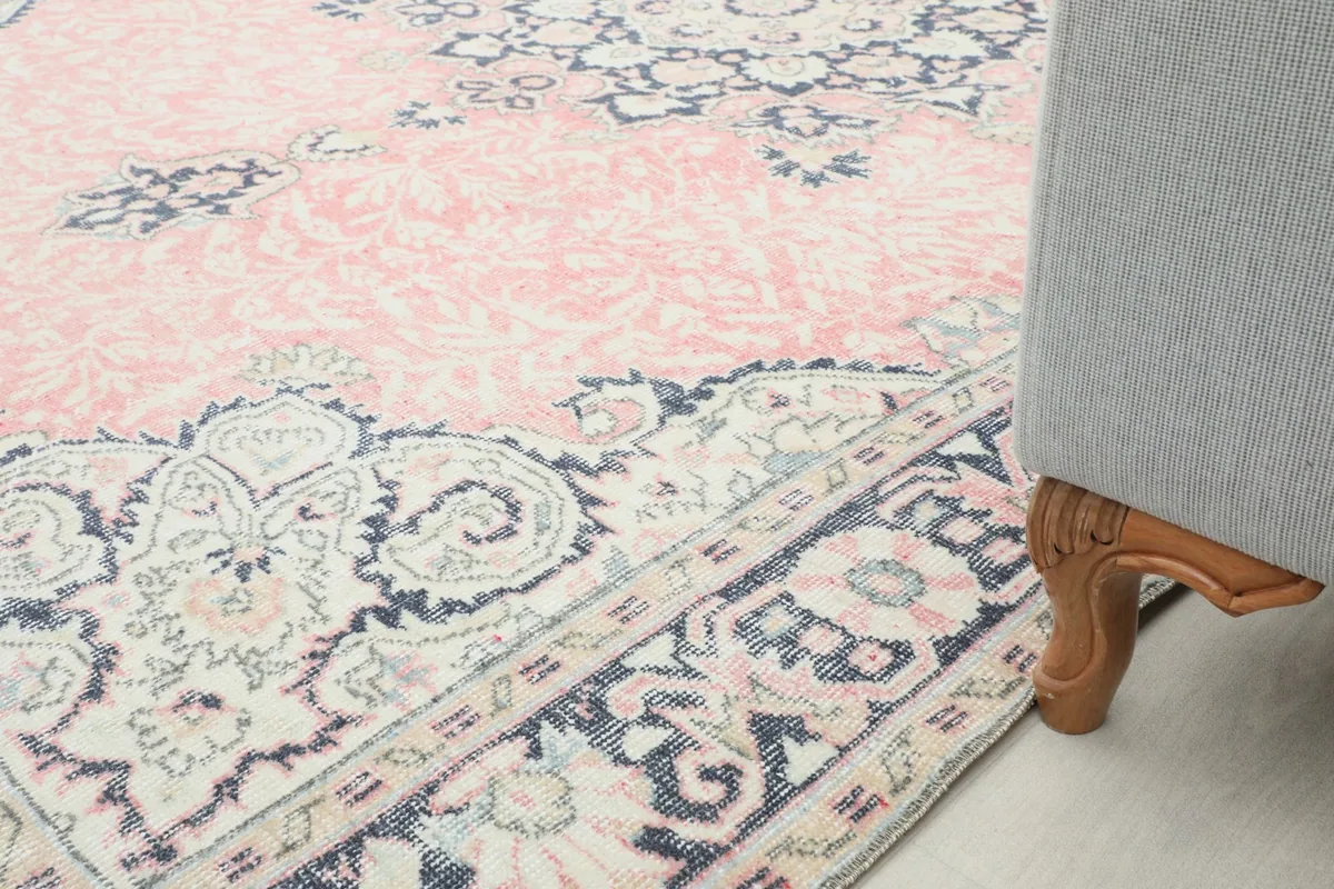 Rug corner next to a furniture leg, showing the rug's placement in a room