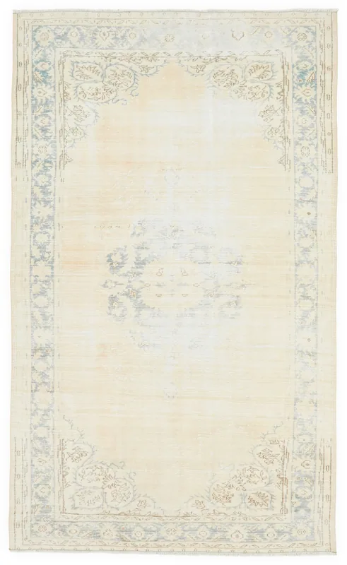 Full overhead view of the 6'0" x 10'1" ivory and blue vintage Anatolian area rug