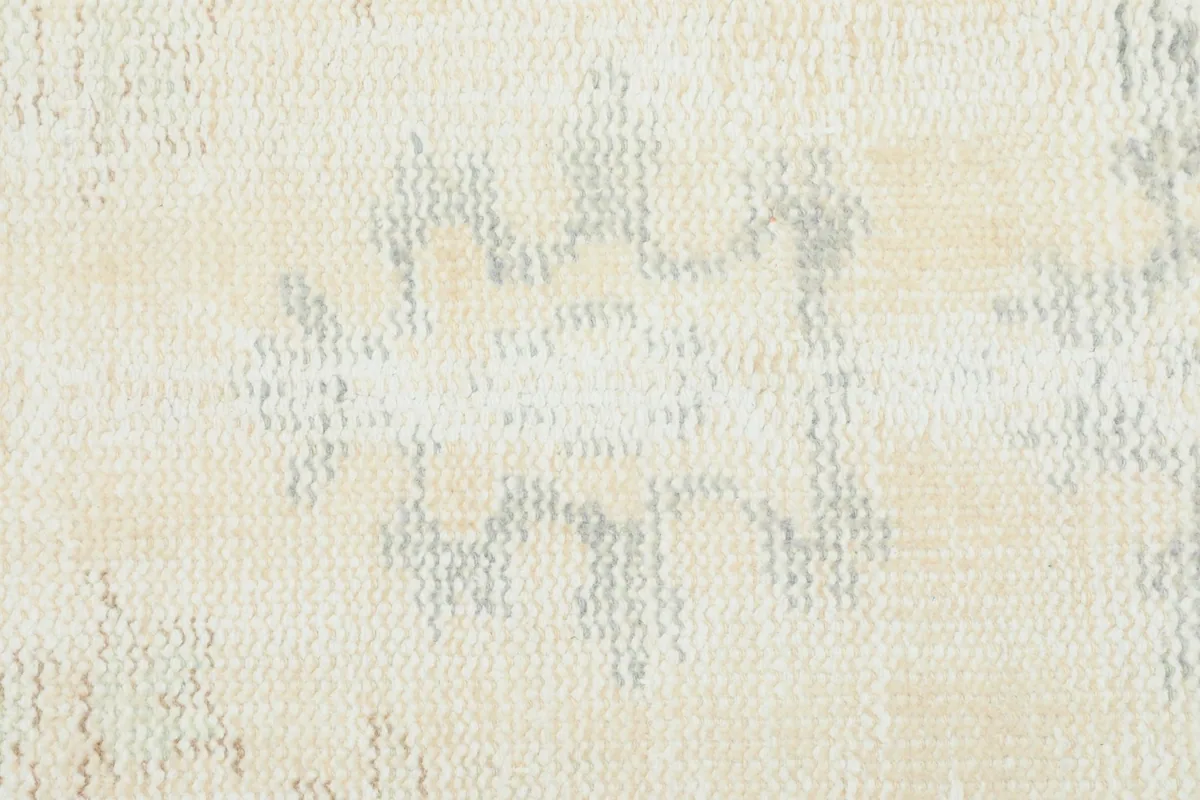 Close-up showing the low pile texture and subtle color variations of the wool