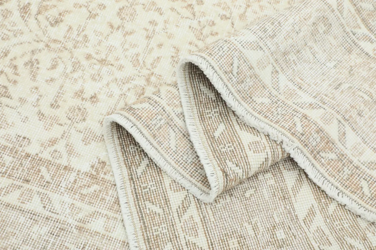 Folded section of the rug, showing the flexibility and texture of the vintage wool