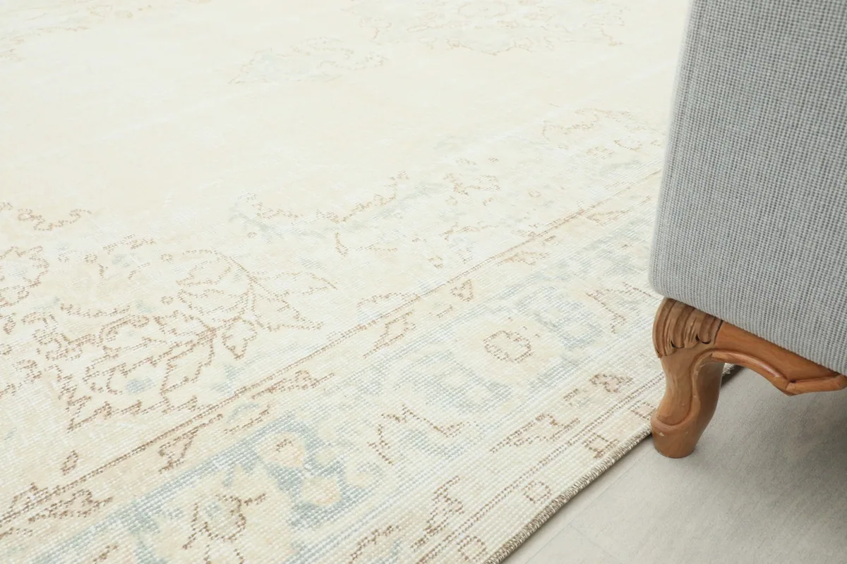 Rug placed under a sofa, showing its scale and integration in a room