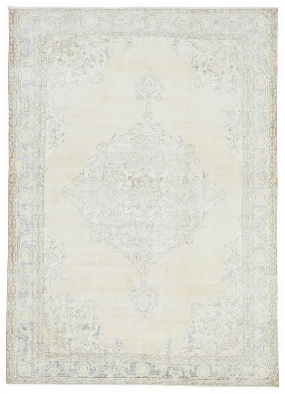 Full top view of the cream and blue medallion vintage Anatolian rug