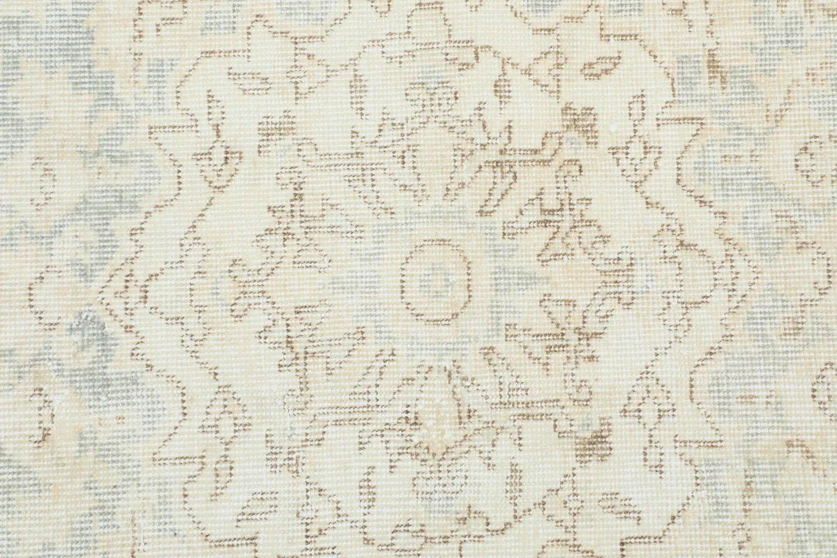 Close-up of the intricate patterns within the medallion and surrounding field