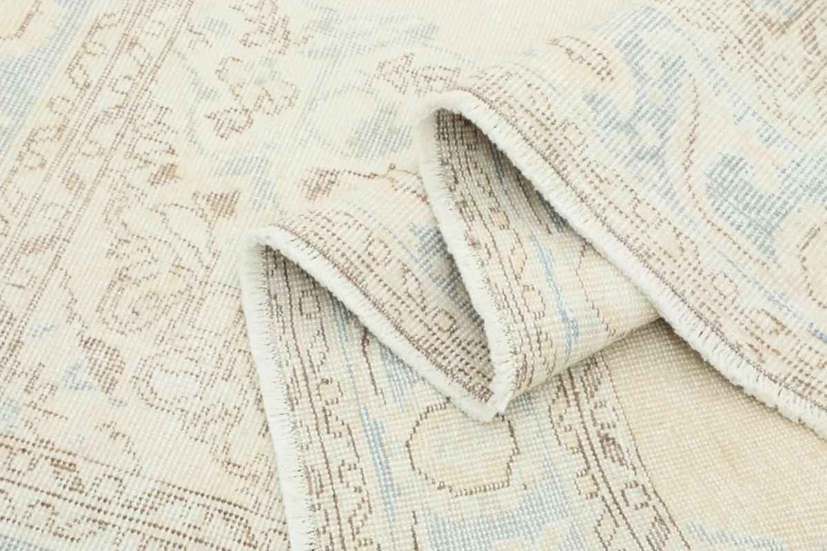 Rug folded to highlight its soft texture and the vintage wool pile