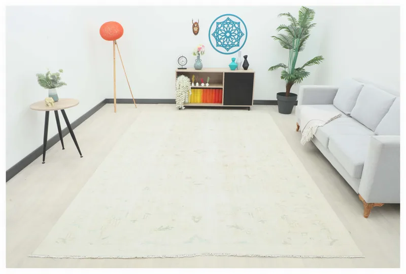 Full top view of the 7'6" x 11'0" ivory vintage Anatolian area rug on a white background