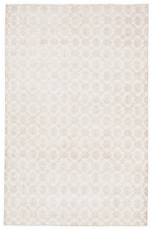 Full overhead view of the ivory and rose floral vintage Anatolian rug on a white background.