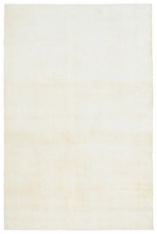 Full overhead view of the 6'7" x 10'1" cream vintage Anatolian wool rug
