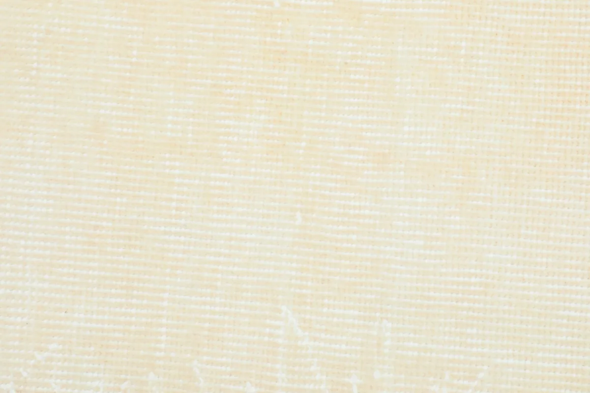 Detailed view of the rug's reverse side, showing the tight hand-knotted cotton foundation