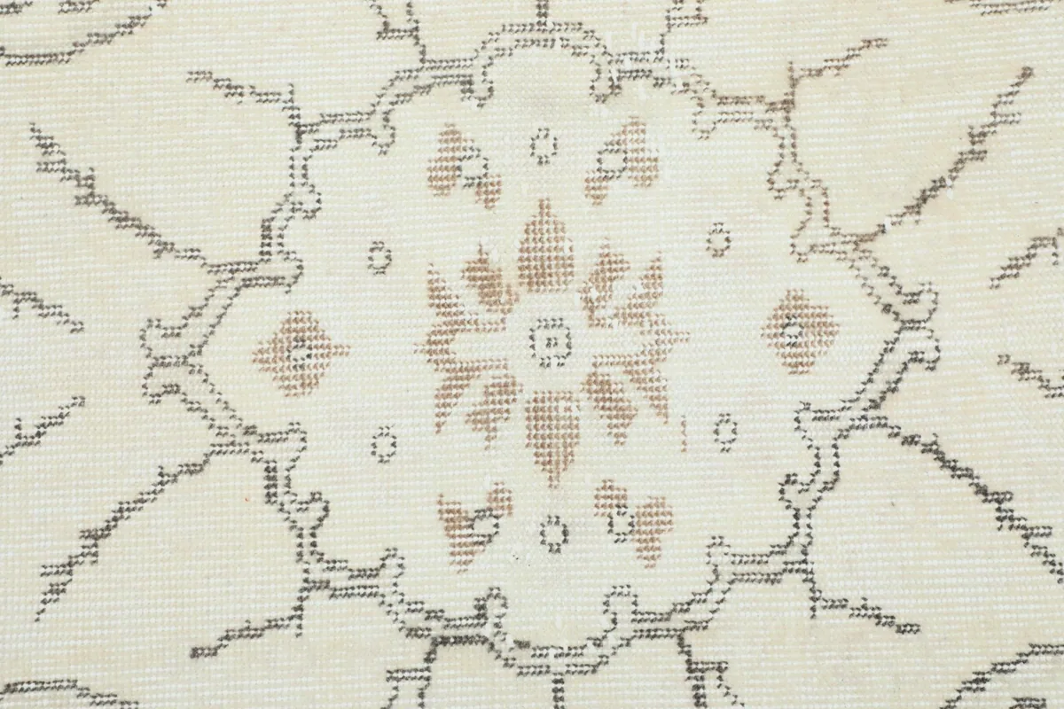Close-up of the intricate floral pattern within the rug's central medallion