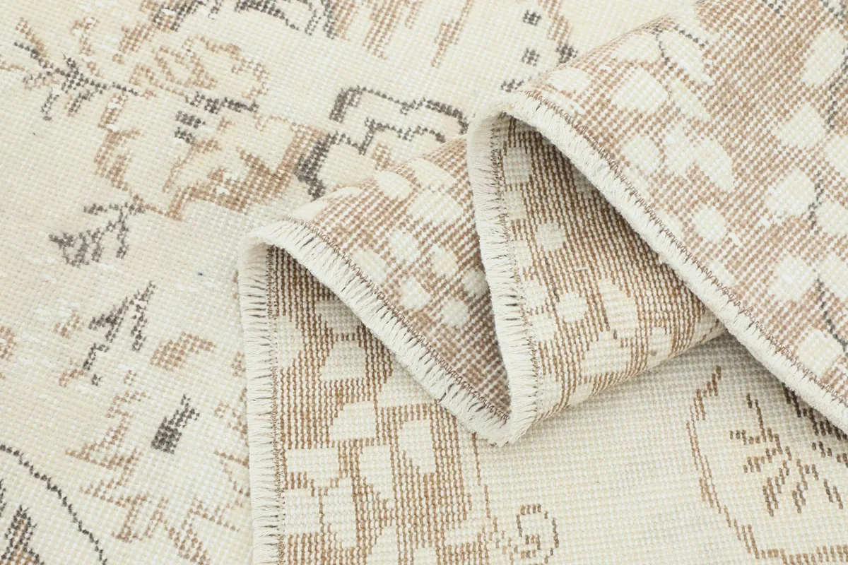 Folded section of the rug revealing the density of the hand-knotted construction