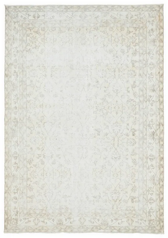 Full top view of the beige and ivory vintage Anatolian area rug on a white background