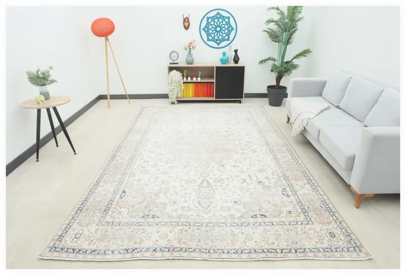 Full overhead view of the 7'3" x 11'1" ivory vintage Anatolian rug with floral medallion design