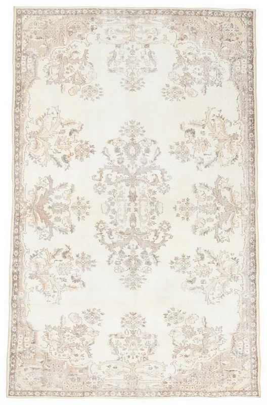 Full top view of the vintage ivory and tan floral Anatolian rug