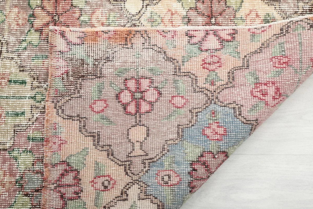 Close-up of the rug's reverse side, showing the hand-knotted construction and individual knots