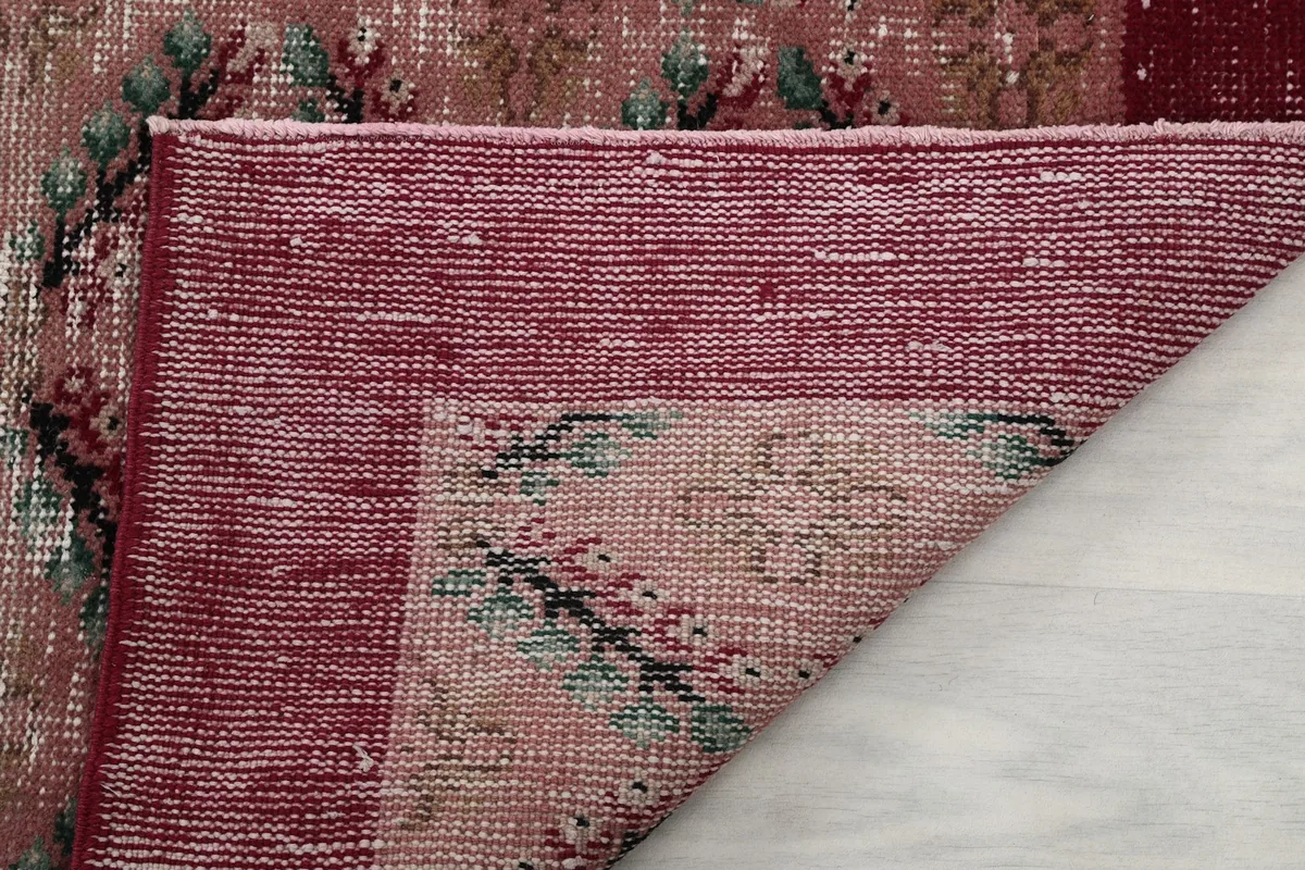 View of the cotton foundation and the reverse side of the hand-knotted vintage rug