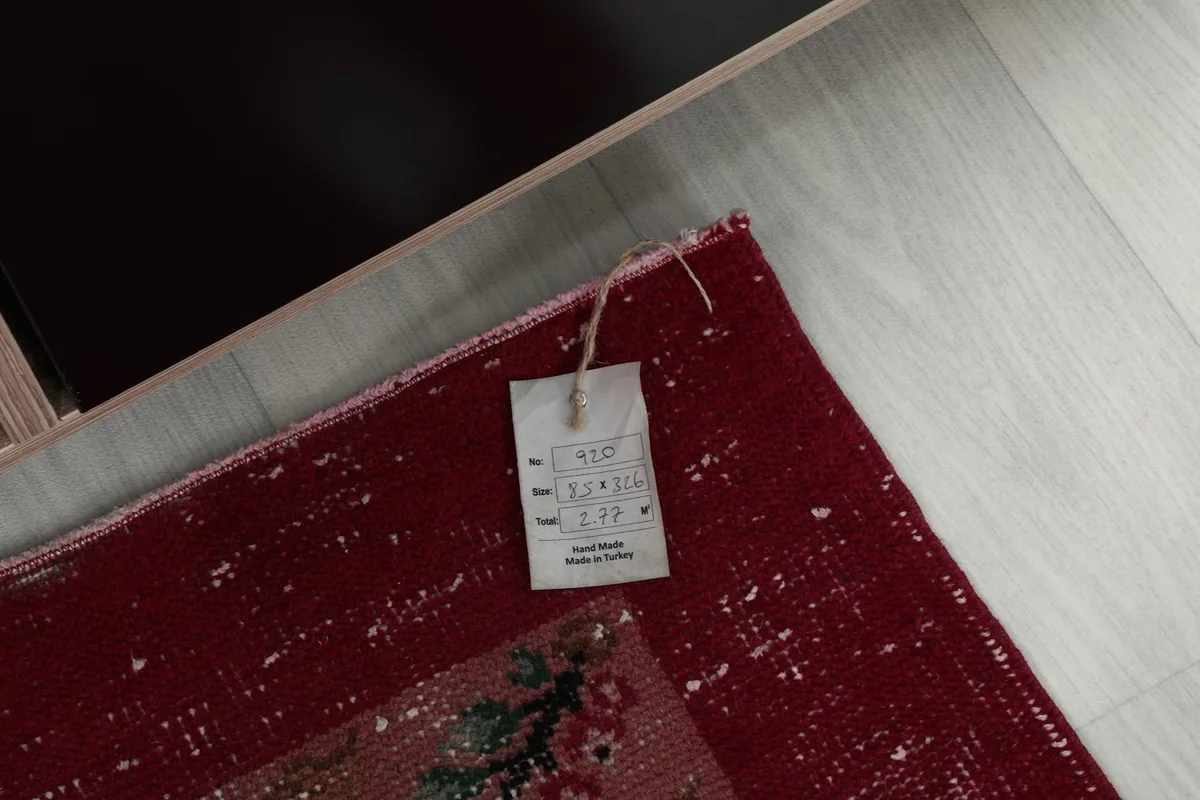 Tag on the back of the rug displaying size and origin information