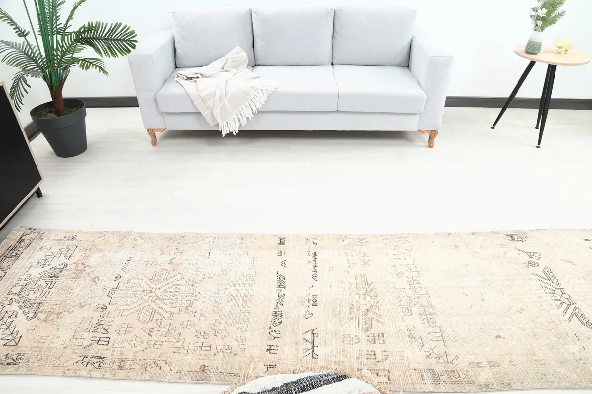 Overhead view of the runner rug extending from a sofa in a contemporary room