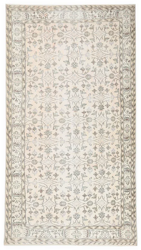 Full top view of the 5x9 cream floral vintage Anatolian rug on a white background.