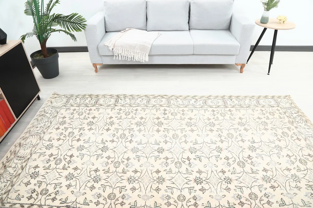 Overhead view showing the full length of the 5x9 vintage rug in a room setup.