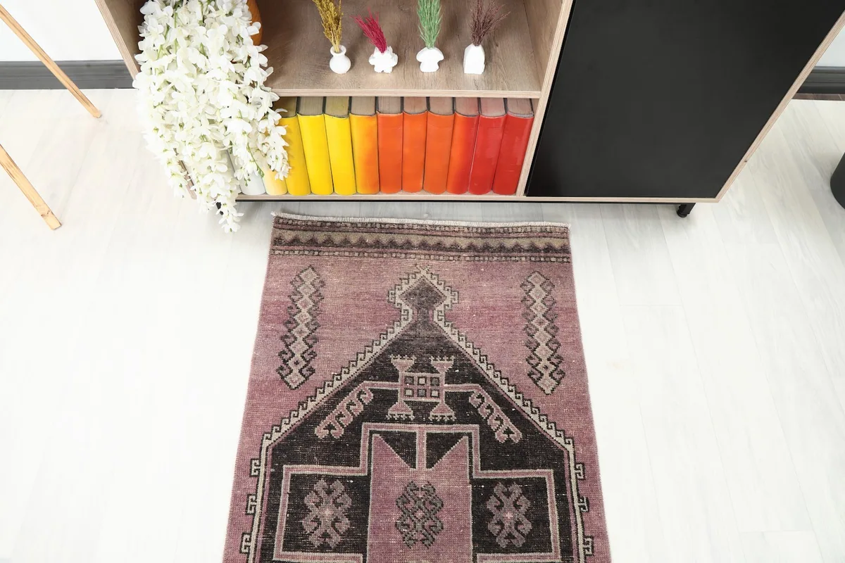 Angled overhead shot of the runner rug, focusing on one end and nearby furniture