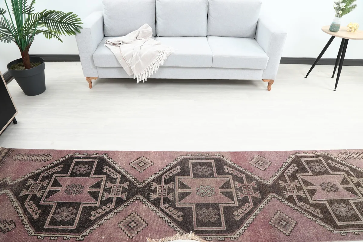 Overhead view of the runner rug in a room, showing its position relative to a sofa