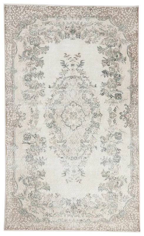 Full overhead view of the 5'5" x 8'10" ivory vintage Anatolian rug with floral medallion