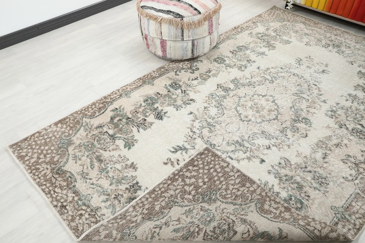 Rug corner folded back to reveal the hand-knotted construction and the cotton foundation
