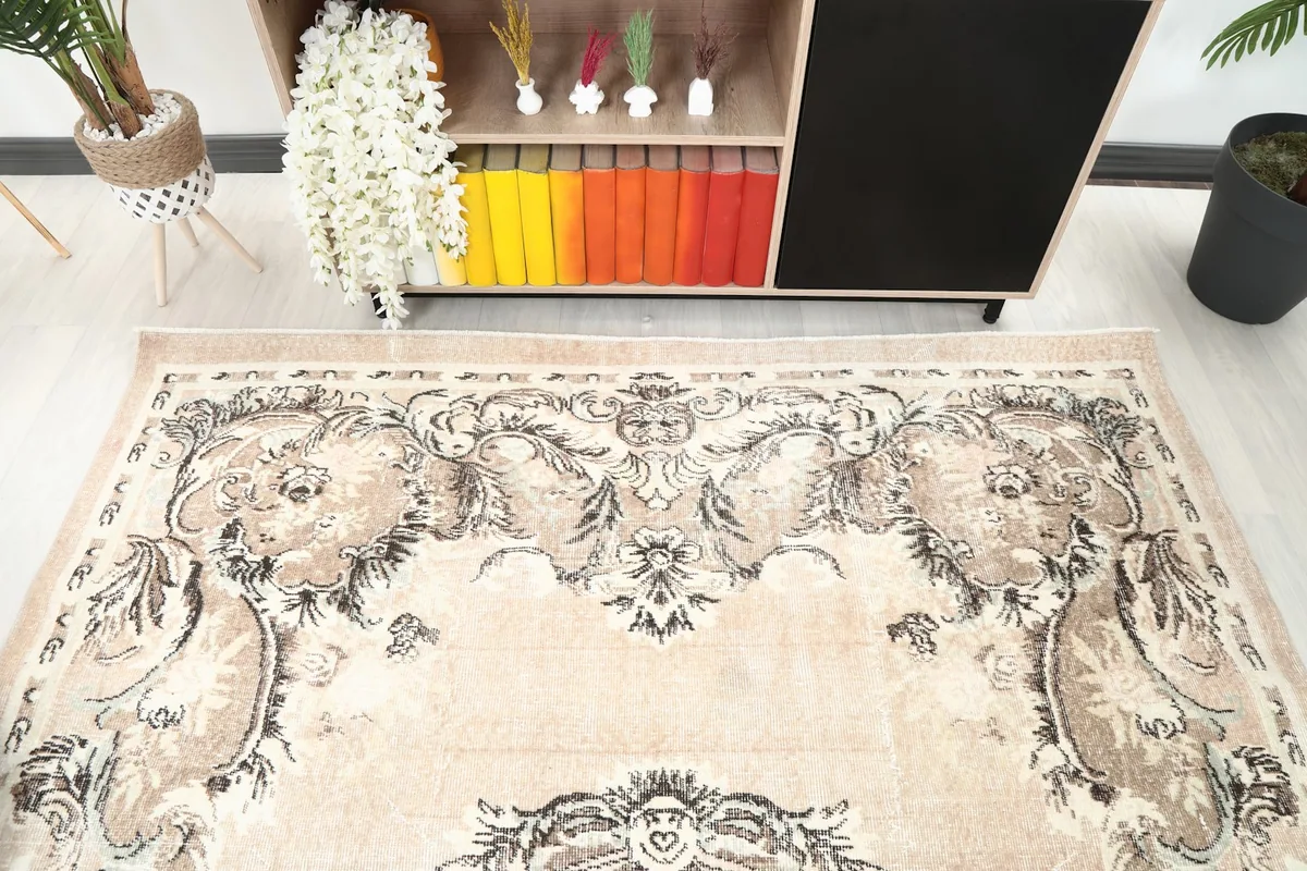 Detailed view of the rug's upper section, showcasing the distressed texture and color variations.