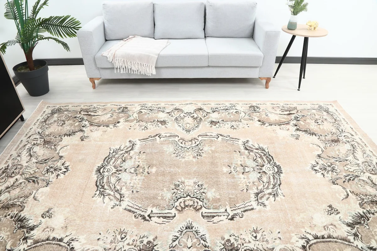 Overhead view of the rug's center, showing the intricate medallion and surrounding patterns.