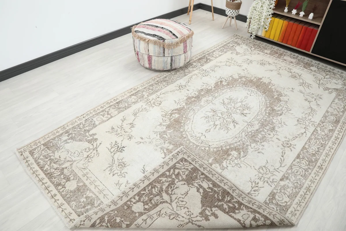 Rug partially folded back, revealing the reverse side and the hand-knotted construction