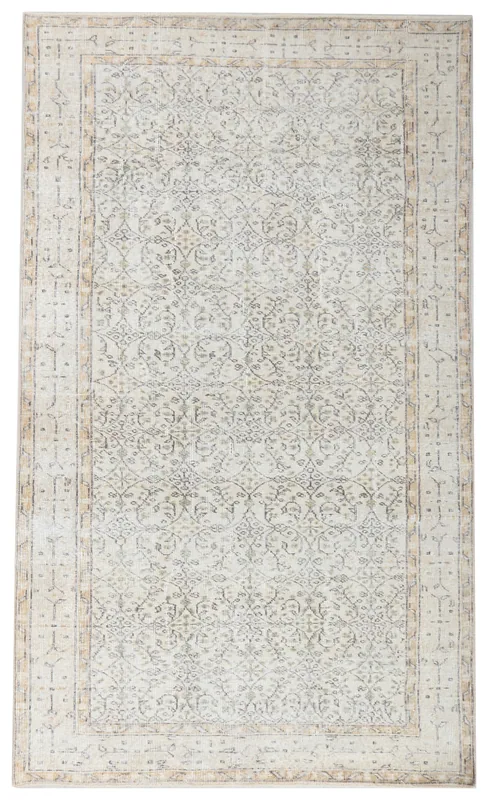 Full overhead view of the vintage 4'11" x 8'5" cream and olive Anatolian rug