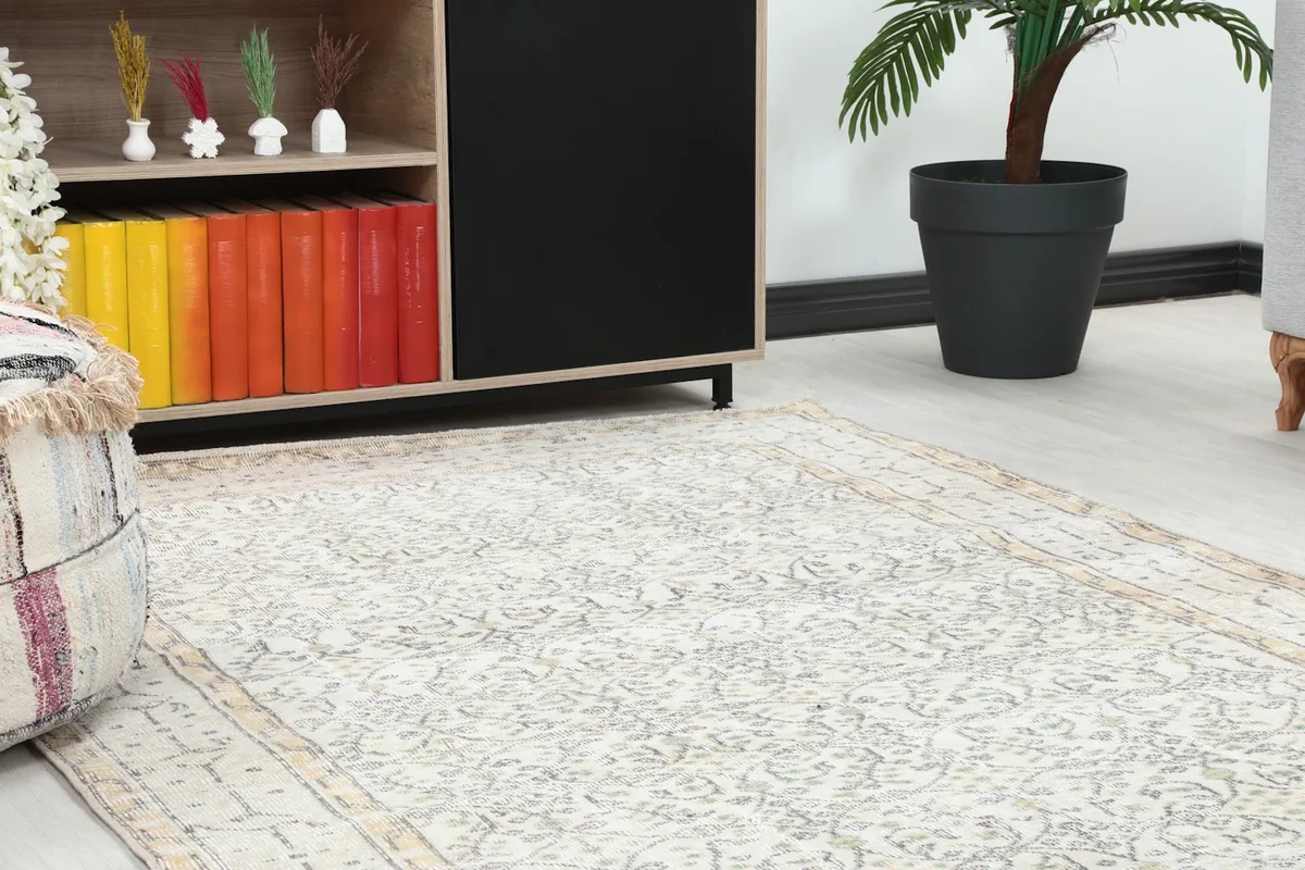 Close-up view of the rug's pattern and border in a room setting