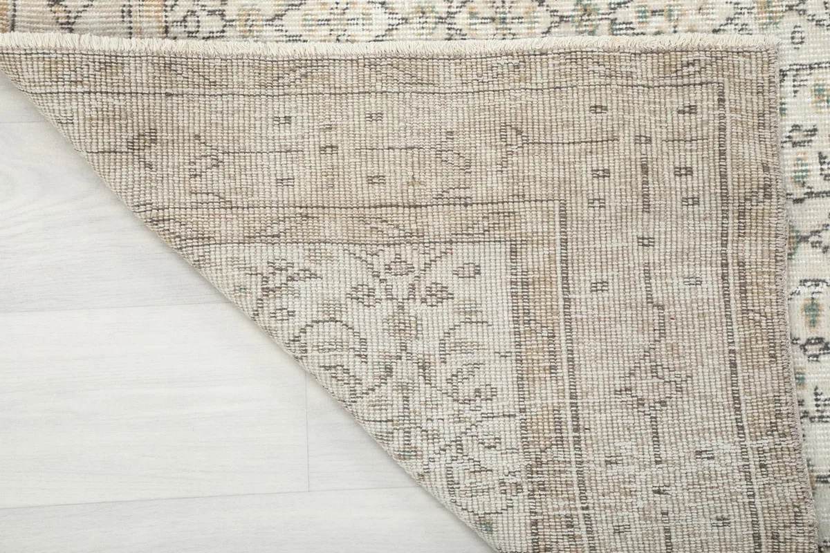 Close-up of the rug's backside, revealing the hand-knotted construction