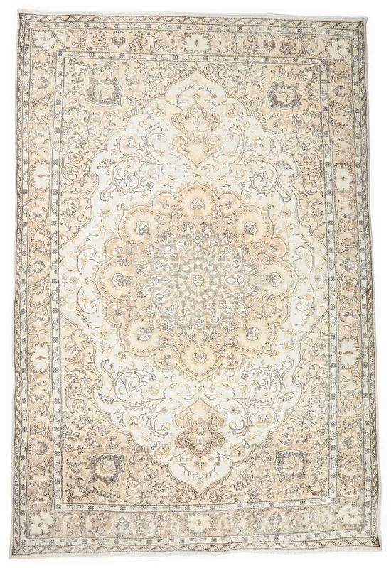 Full top view of the 7x10 ivory and tan vintage Anatolian area rug with a central medallion.