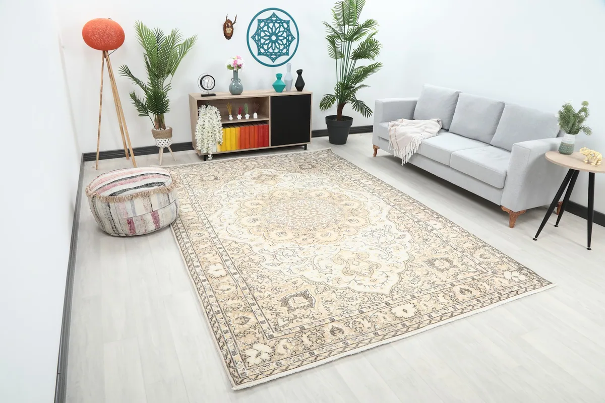 Angle view of the 7x10 vintage Anatolian rug in a living space, showing its scale relative to furniture.