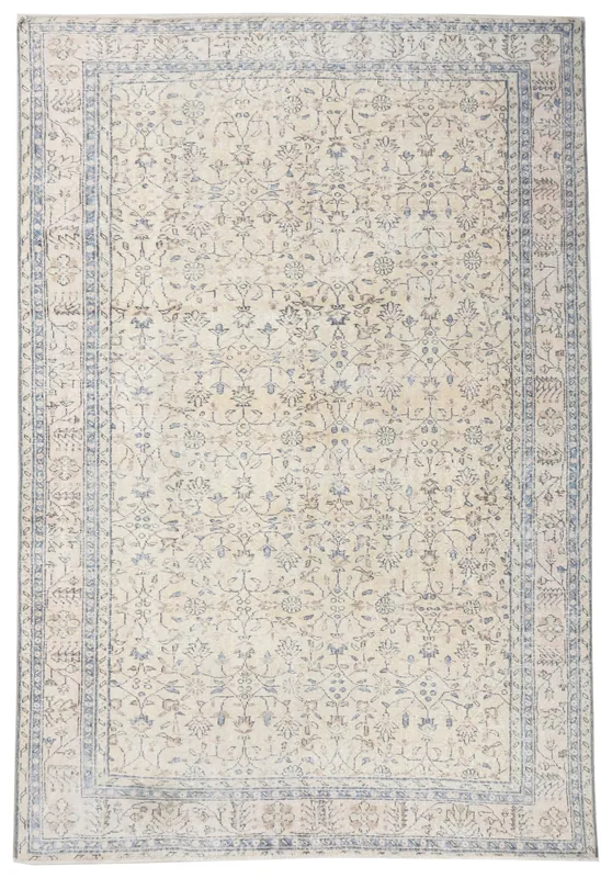 Full top view of the 6'6" x 9'6" ivory and blue vintage Anatolian area rug