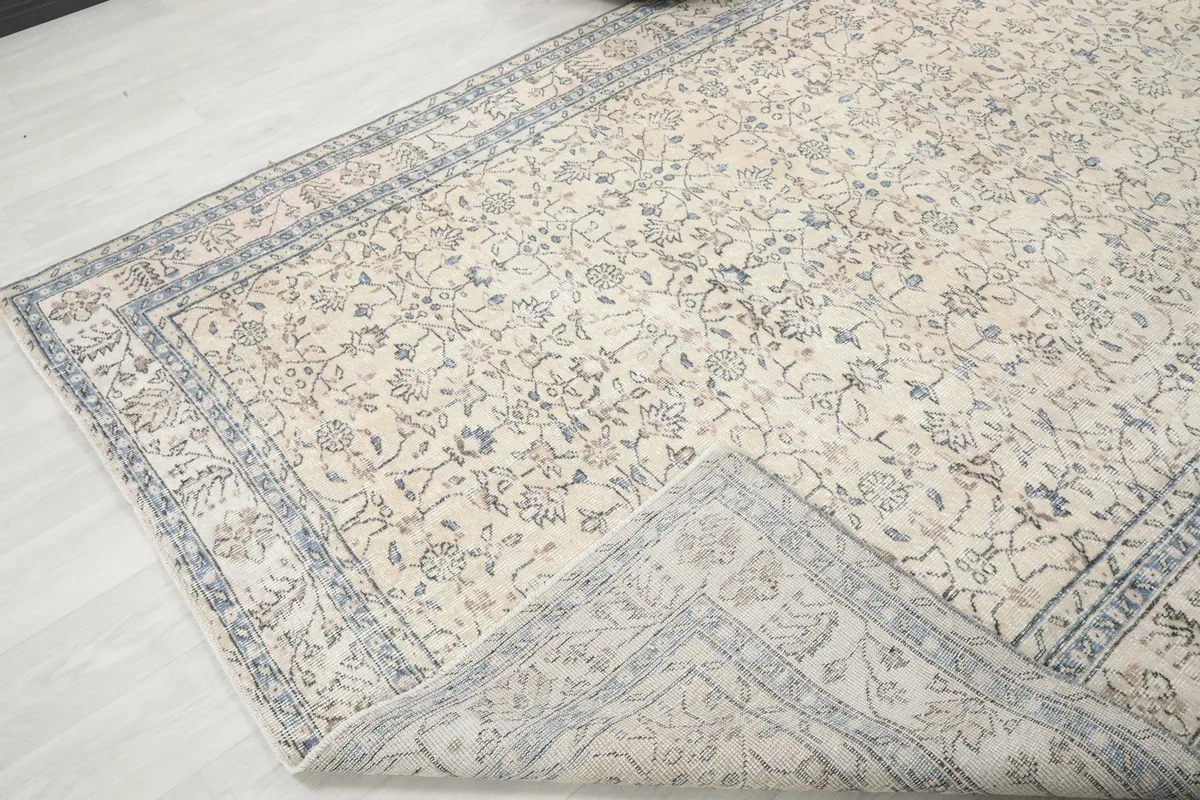 Rug corner folded back, revealing the reverse side and knotting structure