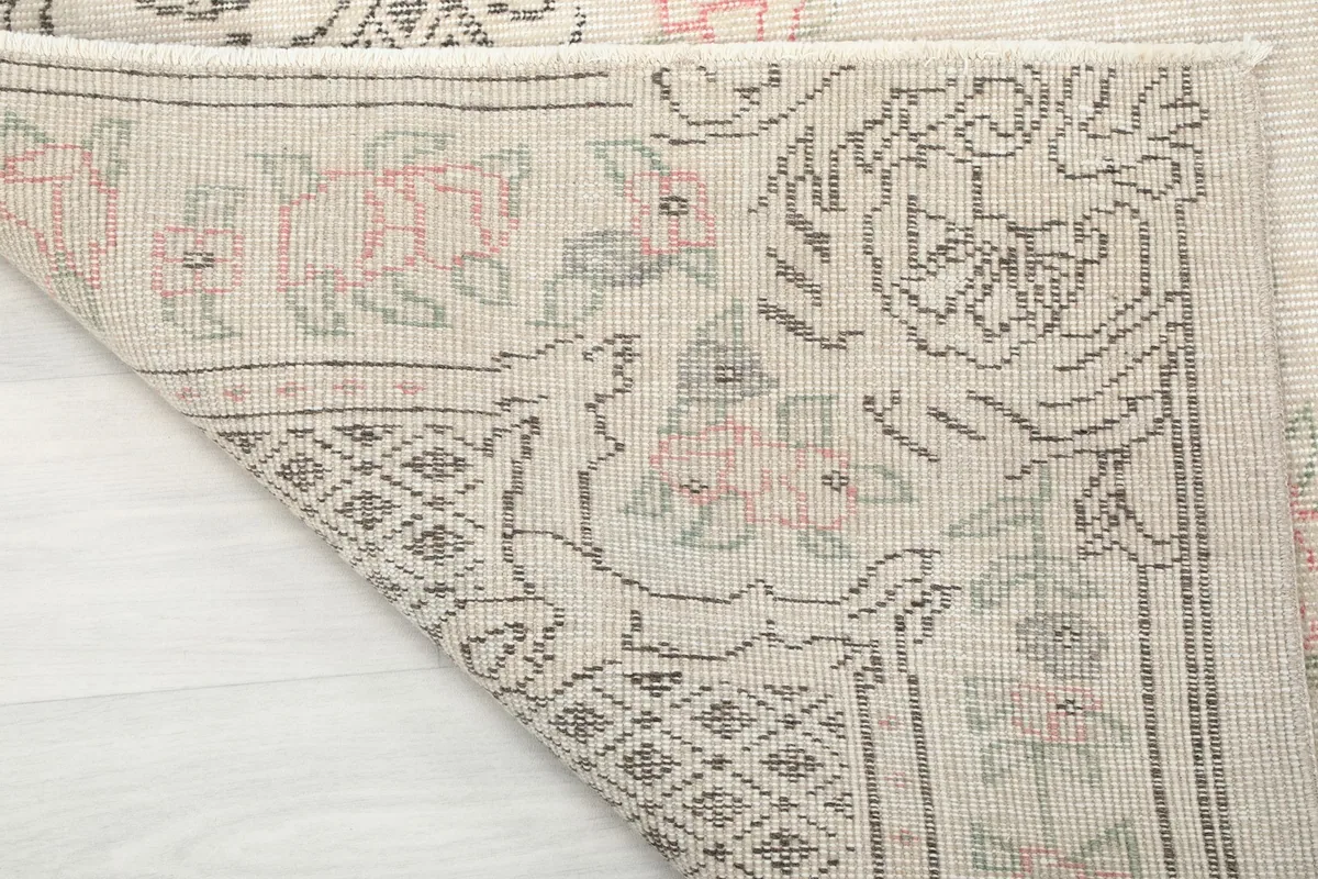 Close-up of the rug's back, showing the consistent hand-knotted wool on cotton foundation