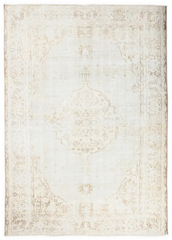 Full overhead view of the ivory and beige vintage Anatolian area rug with a central medallion