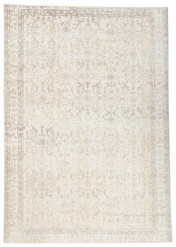 Full overhead view of the 7'1" x 9'7" ivory vintage Anatolian area rug on a white background.