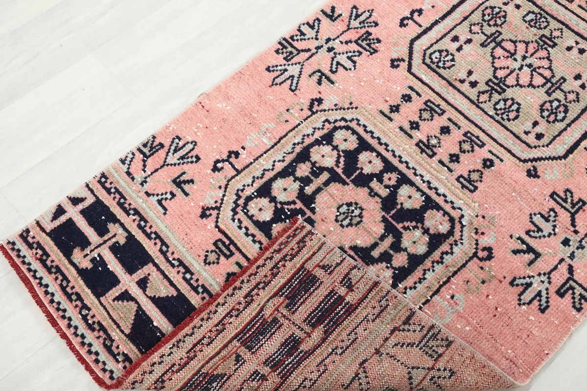 View showing the low wool pile and the hand-knotted construction of the Anatolian runner