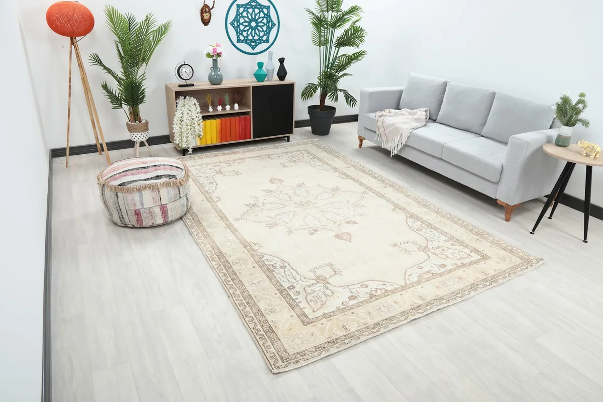 An angle view of the cream rug in a living room, showing its placement relative to furniture