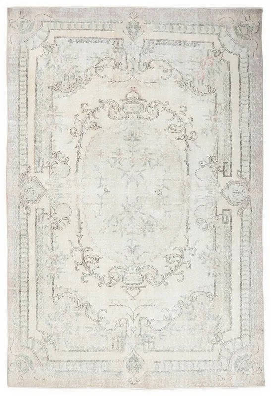 Full overhead view of the 6'2" x 9'2" ivory vintage Anatolian rug with botanical medallion.