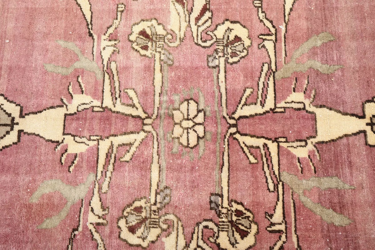 Close-up of the intricate floral patterns within the rug's medallion