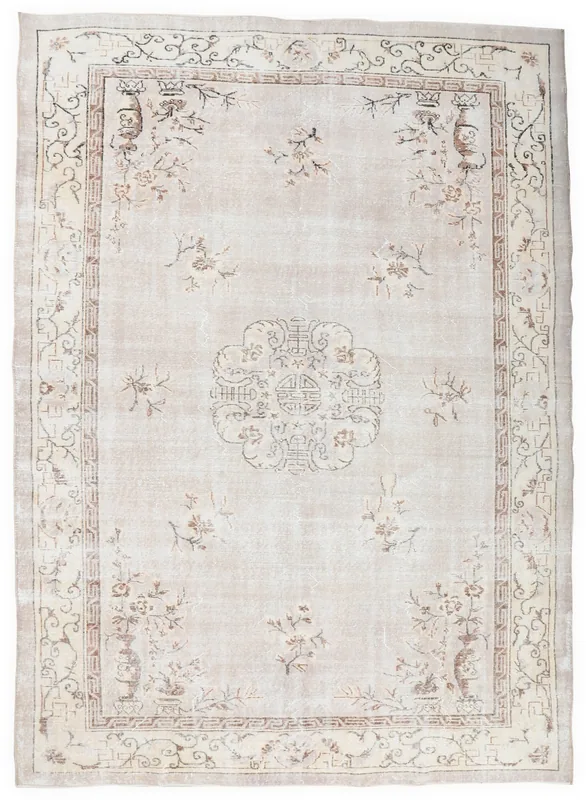 Full overhead view of the beige Chinoiserie medallion vintage rug on a white background