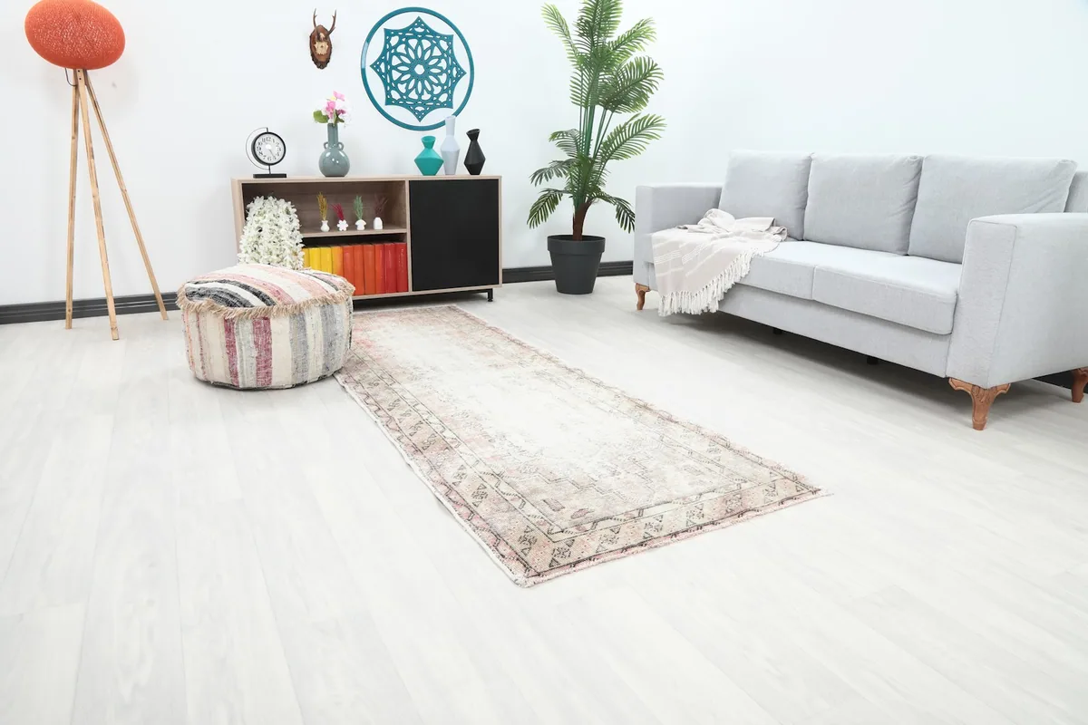 Angle view of the geometric Anatolian runner rug extending into a bright room